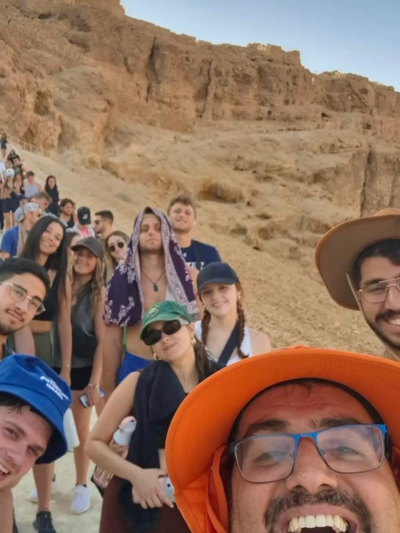 Itzik with a tour group in the desert